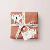 Happy Koala swaddle folded and tied with ribbon for gifting